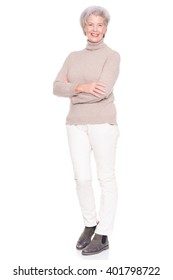 Senior Woman Standing In Front Of White Background