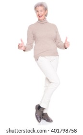 Senior woman standing in front of white background