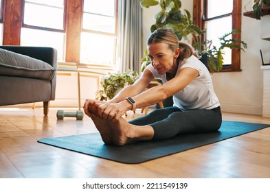 Senior Woman, Stretching And Exercise In Living Room For Fitness, Cardio And Wellness On Yoga Mat Home Training. Retirement, Workout And Healthy Elderly Retired Person Exercising Legs On House Floor