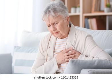 Senior Woman Suffering From Heart Attack At Home