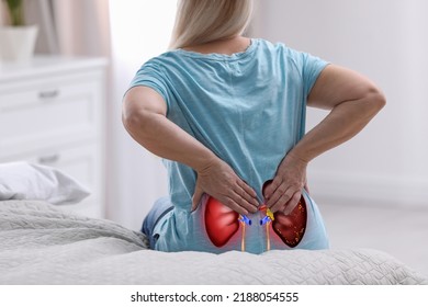 Senior woman suffering from kidney pain at home, closeup - Shutterstock ID 2188054555