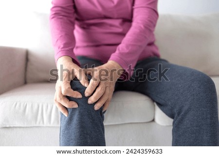senior woman suffering from knee ache