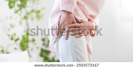 Senior woman suffering from sciatica