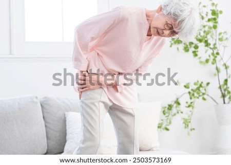Senior woman suffering from sciatica