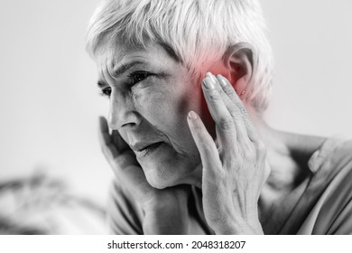 Senior Woman Suffering From Tinnitus 