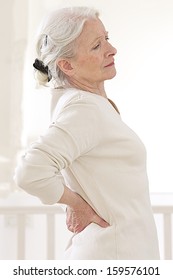 Senior Woman Suffers From Backache. - Mature Female Has Pain In Back 