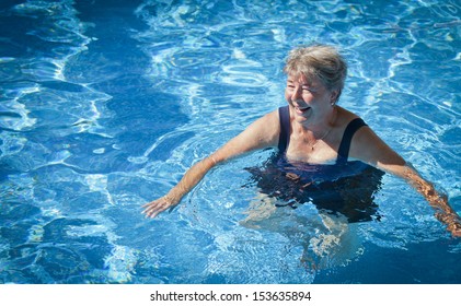 Senior Woman swimming in the Pool