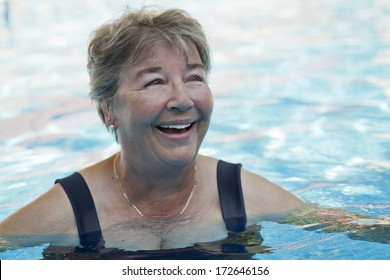 Senior Woman Swimming In A Pool