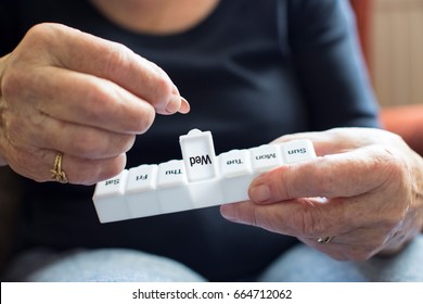 Senior Woman Taking Medication From Pill Box