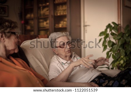 Similar – Senior woman in a wheelchair alone