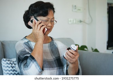 Senior woman talking on a phone and looking at the label on a medication bottle to ask about label and instructions side effects. Old woman taking care herself for health. Health and Medical concept.