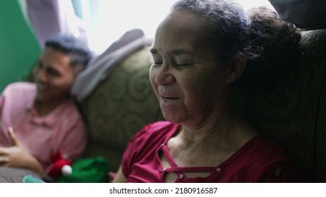 A Senior Woman Talking On Phone Laughing And Smiling. A Hispanic Latin South American Older Person Using Cellphone