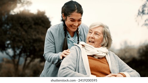 Senior woman, talking and outdoor with caregiver, nurse or healthcare service for person with a disability and wheelchair. Happy, face and elderly lady in park with care and support in retirement - Powered by Shutterstock