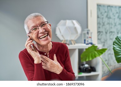 Senior woman talking over her mobile phone, happy and cheerful, positive emotions