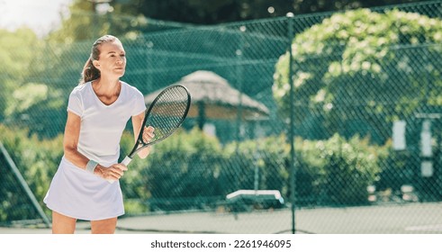 Senior woman, tennis player and ready in sports game for match or hobby on the court. Elderly female in sport fitness holding racket in stance for training or practice in the outdoors on mockup - Powered by Shutterstock