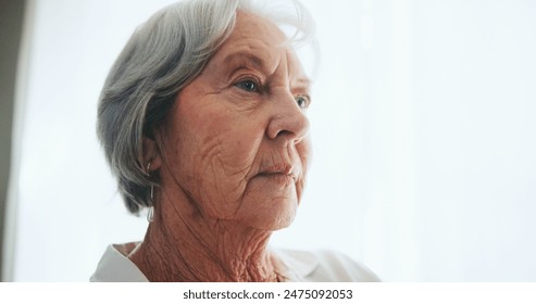 Senior woman, thinking and dream with alzheimers in retirement, pension or elderly home. Face of mature female person in wonder, thought or contemplating for decision, choice or perception at house - Powered by Shutterstock