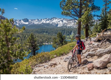 senior woman underway with her electrical mountainbike in the wilderness of Mammoth lakes,California,USA