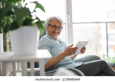 Senior Woman Using A Digital Tablet At Home

