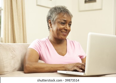 Senior Woman Using Laptop At Home