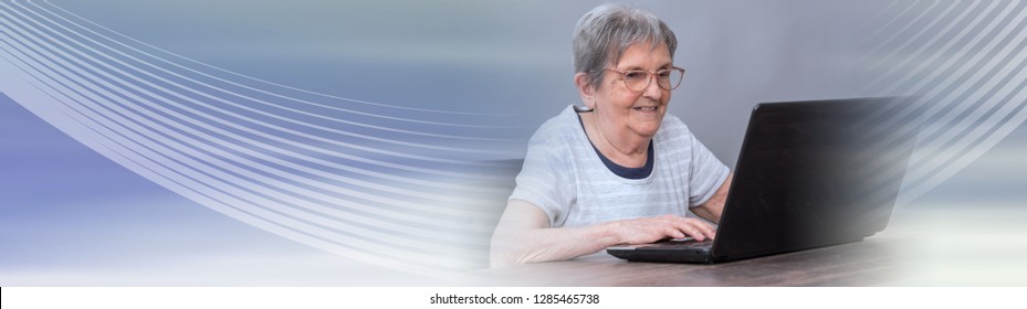 Senior Woman Using A Laptop. Panoramic Banner