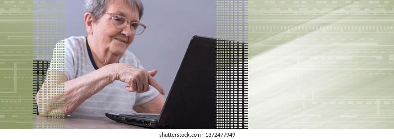 Senior Woman Using A Laptop. Panoramic Banner