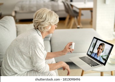 Senior woman using laptop while having video call with her doctor and talking about a medicine.  - Powered by Shutterstock