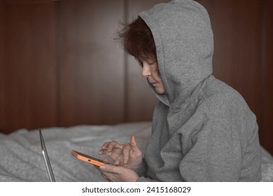 Senior woman using mobile phone at home - Powered by Shutterstock