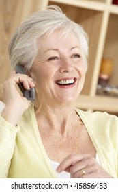 Senior Woman Using Phone At Home