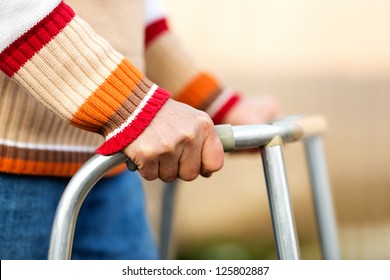 Senior woman using a walker - Powered by Shutterstock