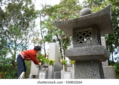 Senior Woman Visiting A Grave