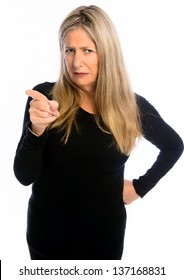 Senior woman wagging finger in front of white background