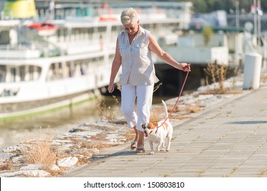 Senior Woman Walking Her Dog