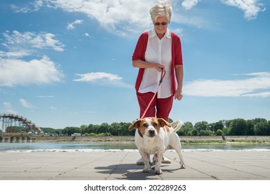 Senior Woman Walking Her Dog