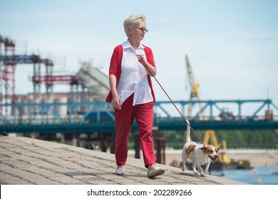 Senior Woman Walking Her Dog