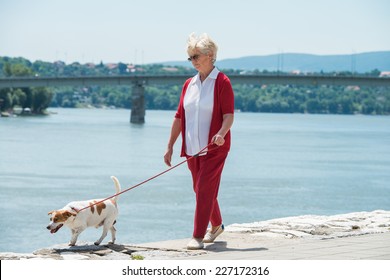 Senior Woman Walking Her Dog