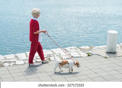 Senior Woman Walking Her Dog