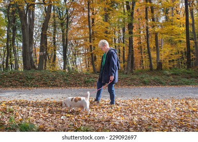 Senior Woman Walking Her Dog