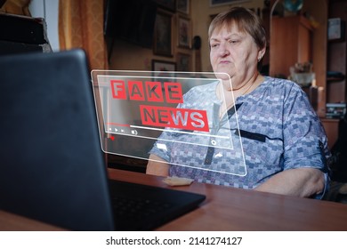 Senior Woman to watch on virtual screen with Fake news. Live video stream political internet social network concept. Fabricated false disinformation technology internet