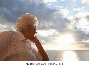 Senior Woman Watching Sunrise