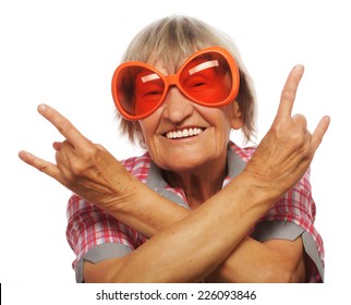 Senior Woman Wearing Big Sunglasses Doing Funky Action Isolated On White Background 