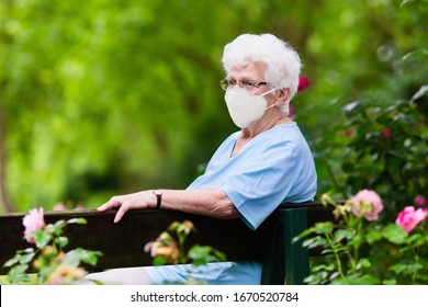 Senior Woman Wearing Face Mask During Corona Virus And Flu Outbreak. Disease And Illness Protection. Surgical Masks For Coronavirus Prevention. Sick Elderly Patient Coughing. Ill Person.