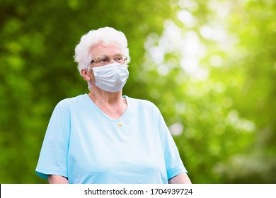 Senior woman wearing face mask during corona virus and flu outbreak. Disease and illness protection. Surgical masks for coronavirus prevention. Sick elderly patient coughing. Ill person. - Powered by Shutterstock