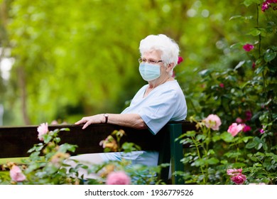 Senior Woman Wearing Face Mask During Corona Virus And Flu Outbreak. Disease And Illness Protection. Surgical Masks For Coronavirus Prevention. Sick Elderly Patient Coughing. Ill Person.