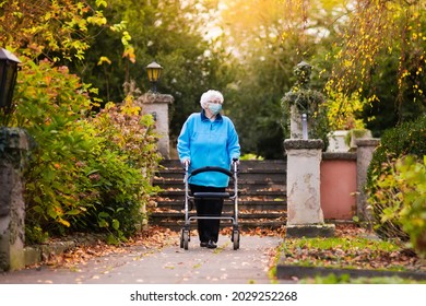 Senior Woman Wearing Face Mask During Coronavirus And Flu Outbreak. Covid-19 Disease And Illness Protection. Older Person In Nursing Home. Sick Elderly Patient Coughing. Disabled Person At Risk.