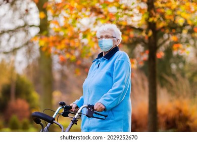 Senior Woman Wearing Face Mask During Coronavirus And Flu Outbreak. Covid-19 Disease And Illness Protection. Older Person In Nursing Home. Sick Elderly Patient Coughing. Disabled Person At Risk.