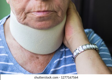 Senior Woman Wearing Neck Brace 