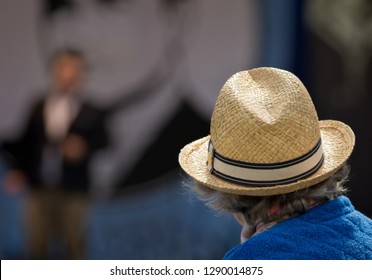 Senior Woman Wearing A Straw Hat At Outdoor Concert