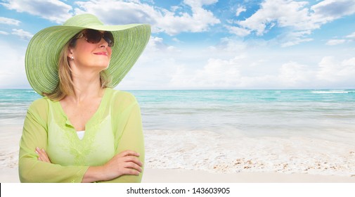 Senior woman wearing sunglasses and a hat. Vacation. - Powered by Shutterstock