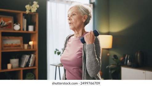 Senior woman, weightlifting and arms with dumbbells in exercise, workout or strength at home. Elderly female person with light weights for lifting or warm up in fitness, practice or training at house - Powered by Shutterstock