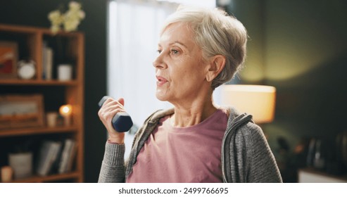 Senior woman, weightlifting and exercise with dumbbell in workout, power or strength at home. Elderly female person with light weights in lifting, warm up or fitness for training or practice at house - Powered by Shutterstock